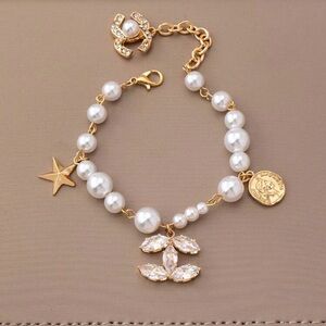 NWT Elegant Gold and Pearl Charm 
Star Coin Crystal Charm Bracelet